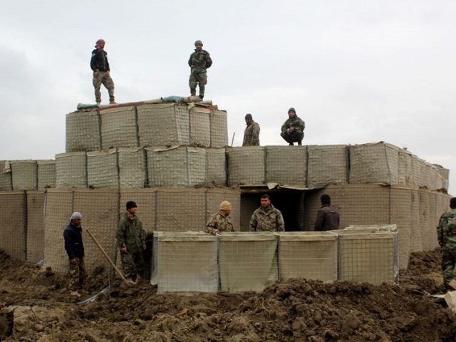 afghan security forces stand guard at an afghan national army ana outpost after an attack by taliban militants in kunduz province on wednesday the us launched an airstrike against taliban fighters to defend afghan forces on march 4 photo afp file