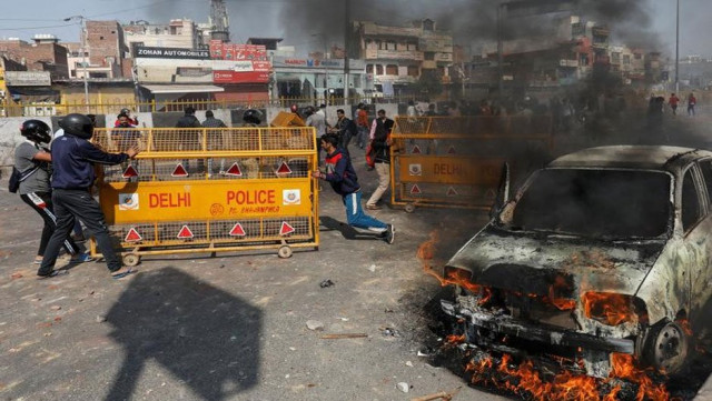 mobs push police barricades during a clash with anti caa protesters in new delhi february 24 photo reuters file mobs push police barricades during a clash with anti caa protesters in new delhi february 24 photo reuters file