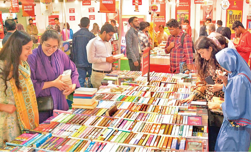 young students browse through books at a stall on the first day of the karachi international book fair on thursday the five day event is organised by the pakistan publishers and booksellers association at the expo centre photo express