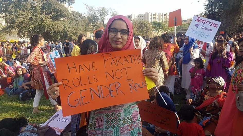 activist holds placard that pokes fun at gender issues being a social construct   photo courtesy aurat march file