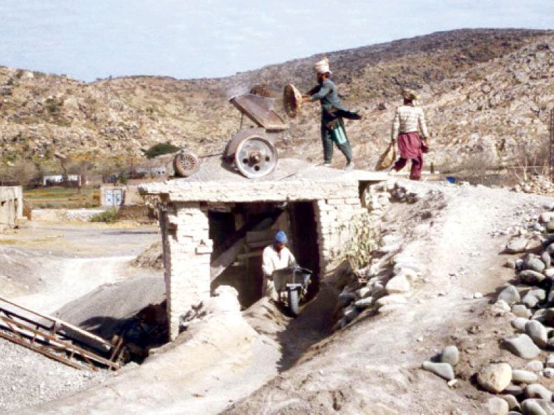 people working at a stone crushing plant photo file