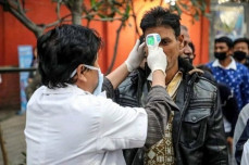 in this handout photograph released by bhutan 039 s prime minister 039 s office on feb 2 2020 a health worker conducts temperature checks at the india bhutan border photo afp