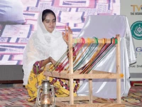 a female student performs old method of weaving during the ongoing 9th hyderabad literature festival at the sindh museum on saturday photo inp