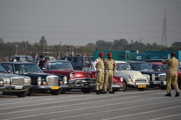 Soldiers snap a quick picture with the vehicles. PHOTO: AFP