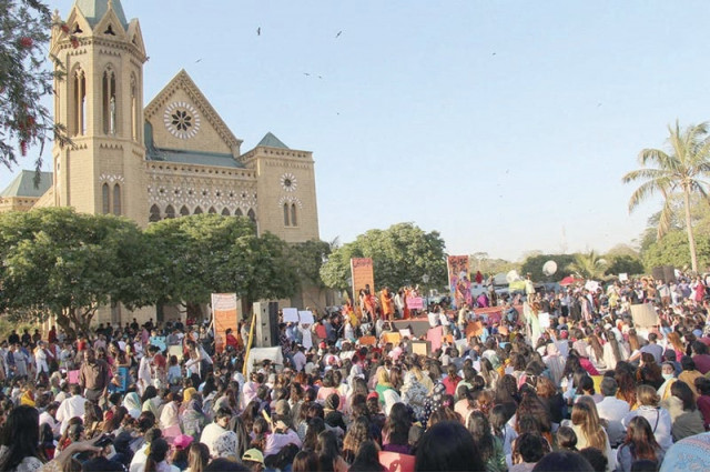 hundreds of participants attend the aurat march at frere hall holding up signs calling attention to the struggles of marginalised communities photos inp nni hundreds of participants attend the aurat march at frere hall holding up signs calling attention to the struggles of marginalised communities photos inp nni