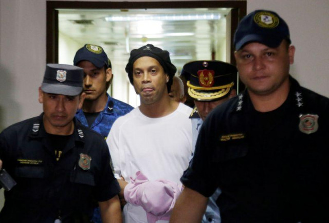 former brazil and barcelona star is being held in a paraguayan jail for using a falsified passport photo reuters former brazil and barcelona star is being held in a paraguayan jail for using a falsified passport photo reuters