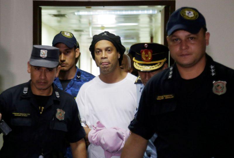 former brazil and barcelona star is being held in a paraguayan jail for using a falsified passport photo reuters