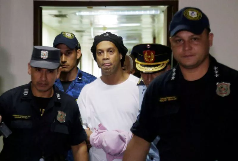 former brazil and barcelona star is being held in a paraguayan jail for using a falsified passport photo reuters former brazil and barcelona star is being held in a paraguayan jail for using a falsified passport photo reuters