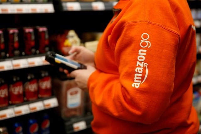 amazon associate cindy umipig checks inventory at a smaller format amazon go store in the blue shift amazon office space at 300 pine street in downtown seattle washington us december 10 2018 photo reuters