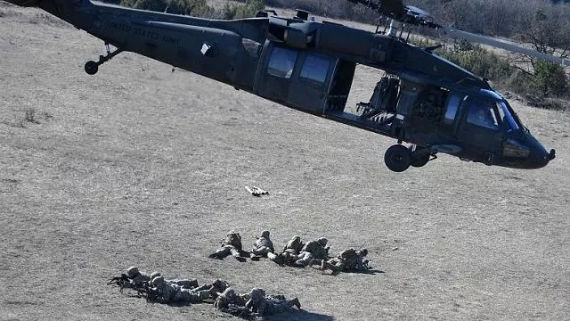 soldiers of an american unit are dropped by a uh 60 black hawk helicopter at a military training center nearby ujdoeroegd hungary on march 5 2020 photo afp soldiers of an american unit are dropped by a uh 60 black hawk helicopter at a military training center nearby ujdoeroegd hungary on march 5 2020 photo afp