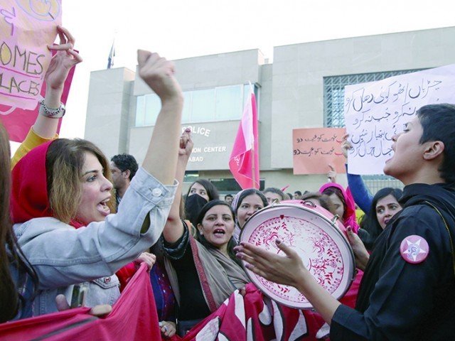 participants chant slogans at the aurat azadi march held in islamabad   photo agencies