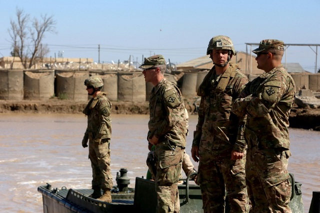 us army forces supervise during a training session at the taji camp north of baghdad   the site of wednesday night 039 s rocket attack photo afp