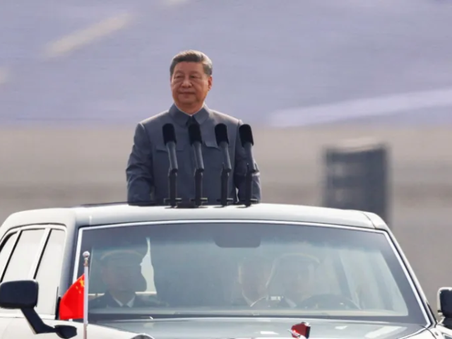 Chinese President Xi Jinping stands in a car in Beijing, China, on September 3, 2025 [Reuters]