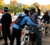 a police officer frisks a biker at a security check post along a road following yesterday s blast outside the district court building reuters a police officer frisks a biker at a security check post along a road following yesterday s blast outside the district court building reuters