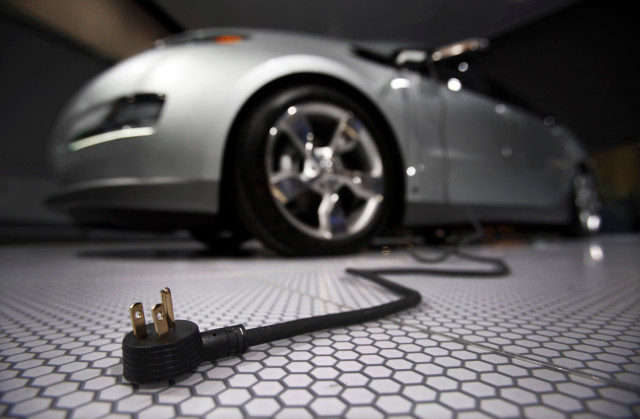 a plug is seen coming from an electric car during the north american international auto show in detroit michigan photo reuters a plug is seen coming from an electric car during the north american international auto show in detroit michigan photo reuters