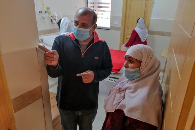 Medical staff members wearing protective masks prepare a room in an isolation ward as a preventative measure following the coronavirus outbreak, at the Pakistan Institute of Medical Sciences hospital in Islamabad. PHOTO: AFP/FIle