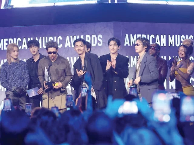 jungkook jin jimin rm j hope v and suga of bts accept the artist of the year award onstage at the 52nd american music awards in las vegas photo reuters jungkook jin jimin rm j hope v and suga of bts accept the artist of the year award onstage at the 52nd american music awards in las vegas photo reuters