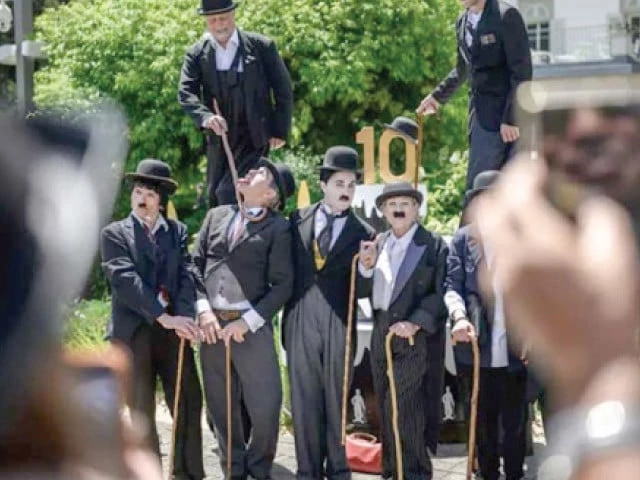 charlie chaplin fans rally at a museum dedicated to the legendary filmmaker at his former home in corsier sur vevey in western switzerland photo afp charlie chaplin fans rally at a museum dedicated to the legendary filmmaker at his former home in corsier sur vevey in western switzerland photo afp