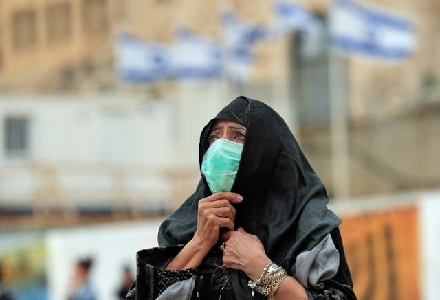 a woman at jerusalem 039 s nearly deserted western wall judaism 039 s holiest site after israel has imposed some of the world 039 s tightest restrictions to contain the new coronavirus photo afp a woman at jerusalem 039 s nearly deserted western wall judaism 039 s holiest site after israel has imposed some of the world 039 s tightest restrictions to contain the new coronavirus photo afp