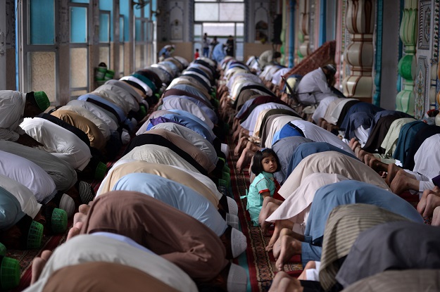 Pakistan Muslims offer Eid al-Fitr prayers at the at the Jamia Mosque in Rawalpindi on June 16, 2018. Muslims around the world are celebrating the Eid festival, marking the end of the fasting month of Ramadan. PHOTO: AFP