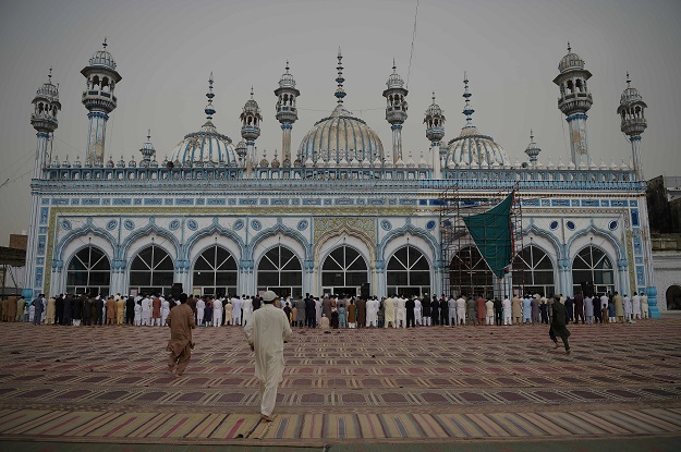 Pakistan Muslims offer Eid al-Fitr prayers at the at the Jamia Mosque in Rawalpindi on June 16, 2018. Muslims around the world are celebrating the Eid festival, marking the end of the fasting month of Ramadan. PHOTO: AFP