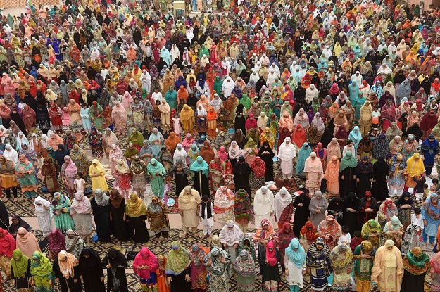 Pakistani Muslim worshippers pray to mark Eid al-Fitr at the Badshahi Mosque in Lahore on June 16, 2018. Muslims around the world are celebrating the Eid festival, marking the end of the fasting month of Ramadan PHOTO: AFP