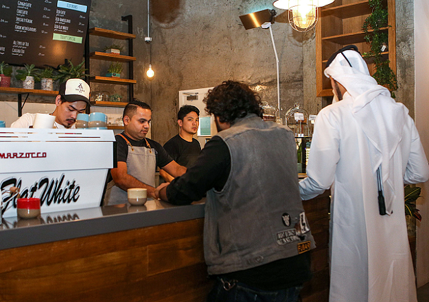 Customers queue for their orders at the