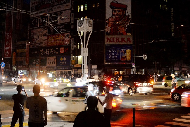 People commute during a blackout in Sapporo, Hokkaido PHOTO: AFP