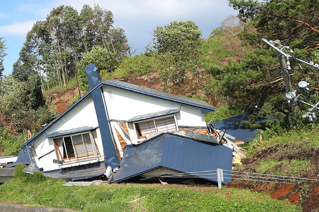 A house is damaged by landslides caused by an earthquake in Atsuma town, Hokkaido PHOTO: AFP