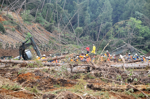 Self defence forces search for missing people in the devastated city of Atsuma. PHOTO:AFP