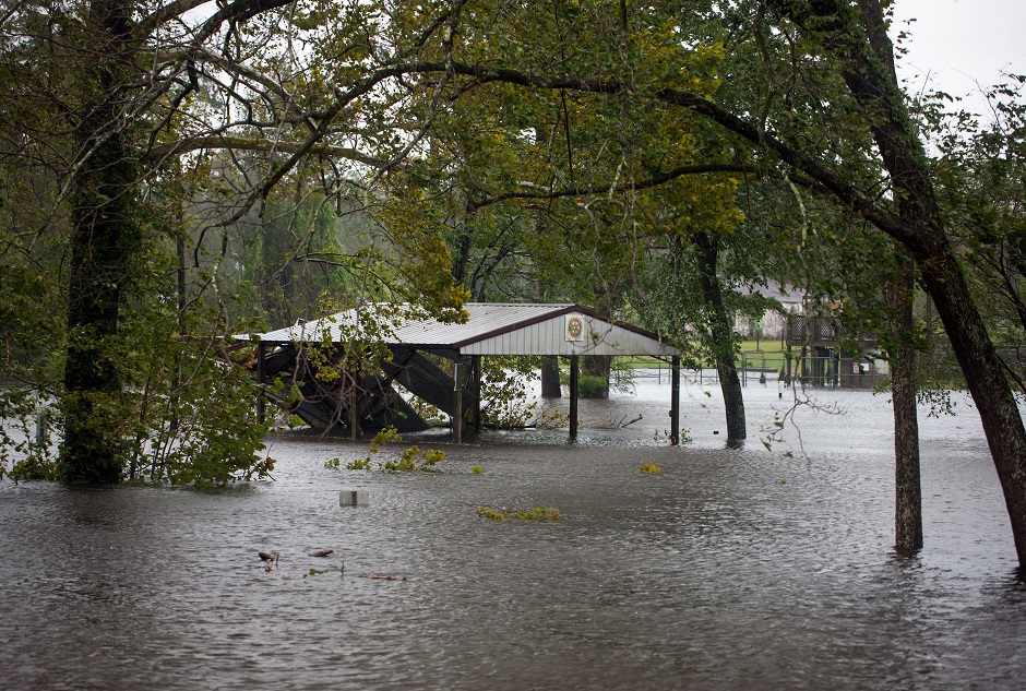 A house is seen destroyed from falling trees as hurricane Florence passes over in Wilmington PHOTO: AFP