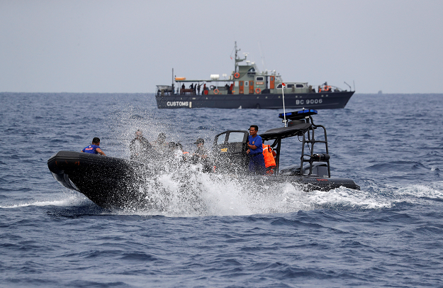  Rescue workers lay out recovered belongings believed to be from the crashed Lion Air flight JT610. PHOTO: REUTERS