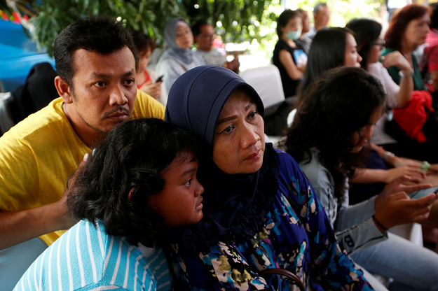  Relatives of passengers on the crashed Lion Air flight JT610 wait at Bhayangkara R. Said Sukanto hospital in Jakarta, Relatives of passengers on the crashed Lion Air flight JT610 wait at Bhayangkara R. Said Sukanto hospital in Jakarta. PHOTO; REUTERS