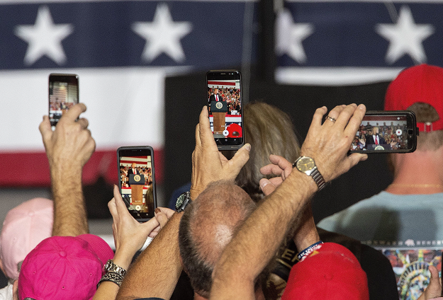 Supporters take photos and videos of US President Donald Trump. PHOTO: AFP