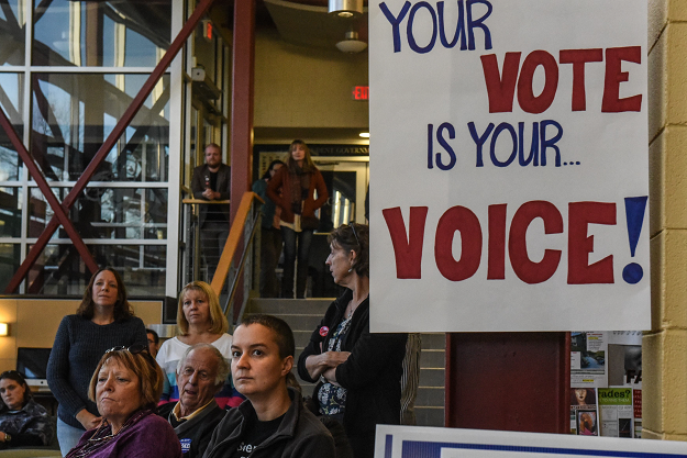 People listen to a speech by Democratic Gubernatorial Candidate Christine Hallquist at the Castleton University. PHOTO: AFP