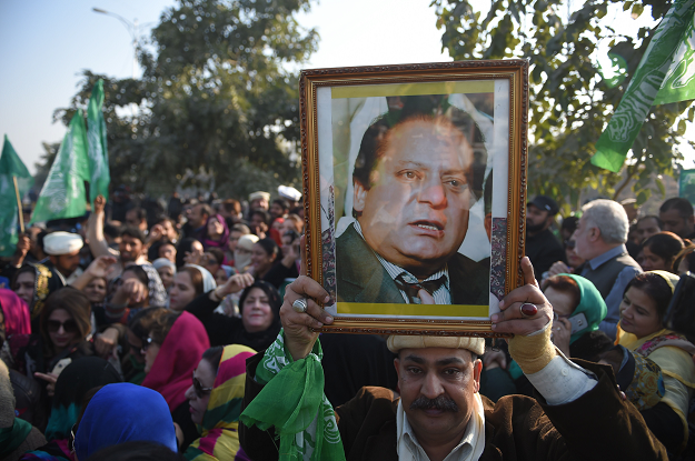 Supporters of former prime minister Nawaz Sharif gather outside the anti-corruption court in Islamabad. PHOTO: AFP