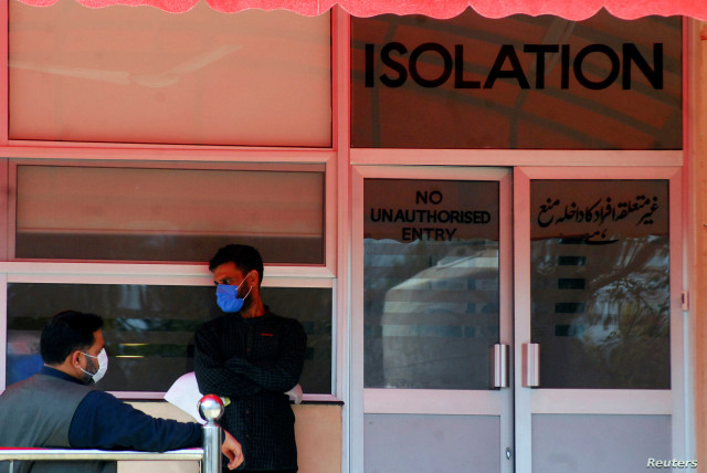 men wear protective mask as a preventive measure against coronavirus as they stand outside the isolation ward at the pakistan institute of medial sciences pims in islamabad pakistan photo reuters men wear protective mask as a preventive measure against coronavirus as they stand outside the isolation ward at the pakistan institute of medial sciences pims in islamabad pakistan photo reuters