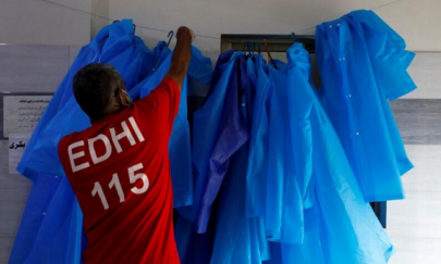 raincoats and rubber boots for pakistani aid workers in coronavirus fight raincoats and rubber boots for pakistani aid workers in coronavirus fight
