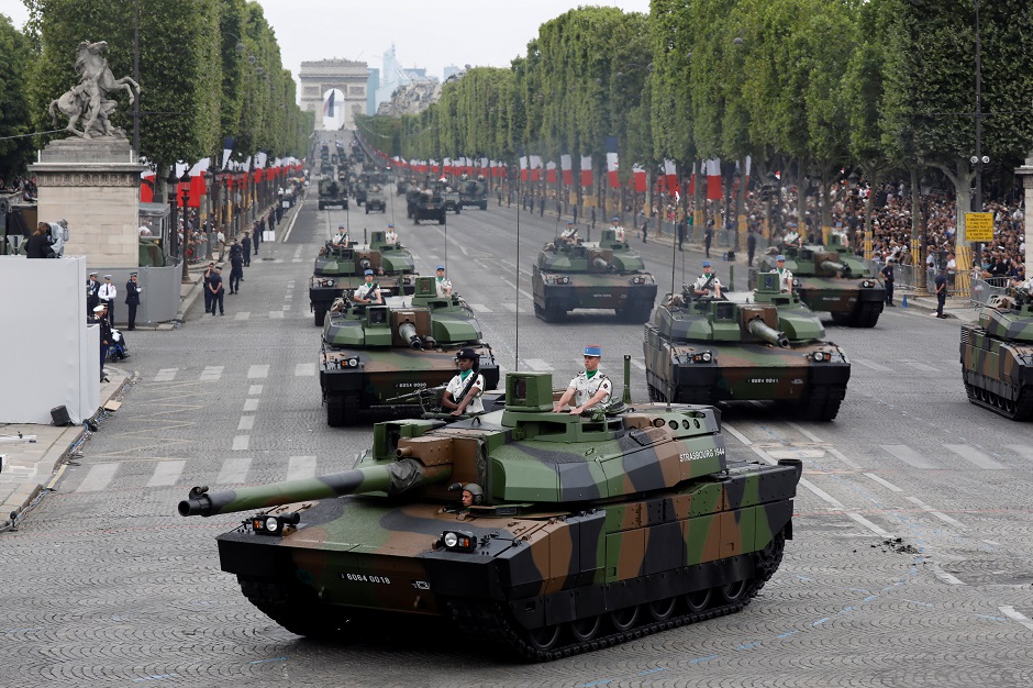French armoured vehicles drive down the Champs-Elysees Avenue during the traditional Bastille Day military parade : REUTERS