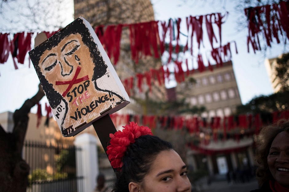 Mostly women take part in a protest against gang violence, with particular focus on sexual violence against women outside the South African Parliament. PHOTO: AFP 