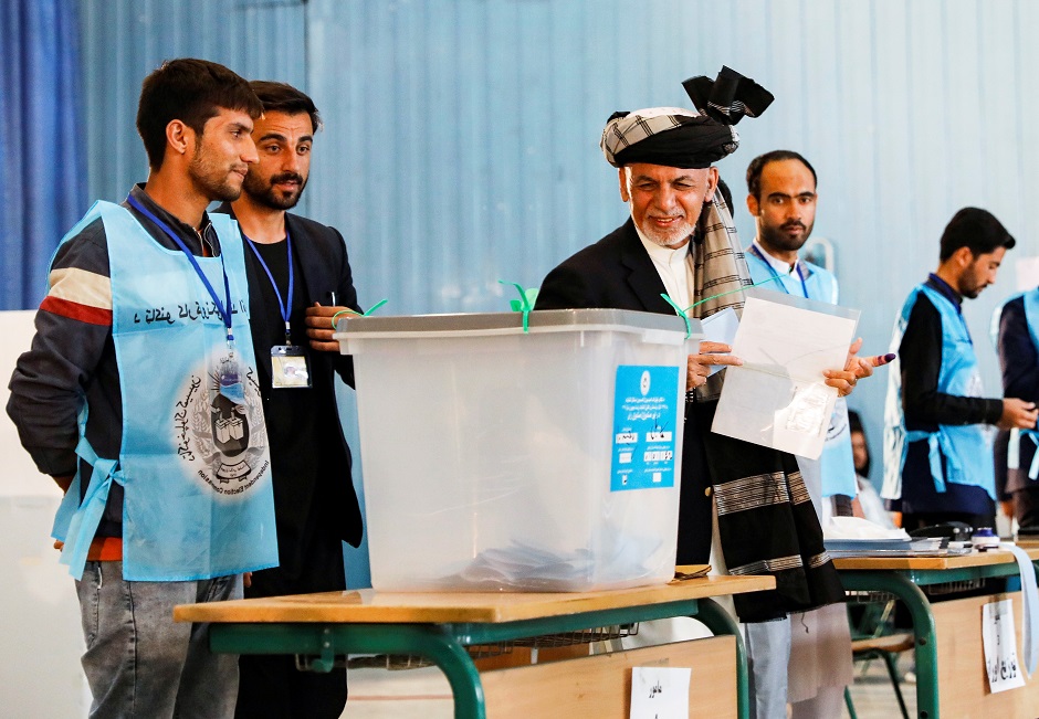 Afghan presidential candidate Ashraf Ghani arrives to cast his vote in the presidential election in Kabul. PHOTO: Reuters 