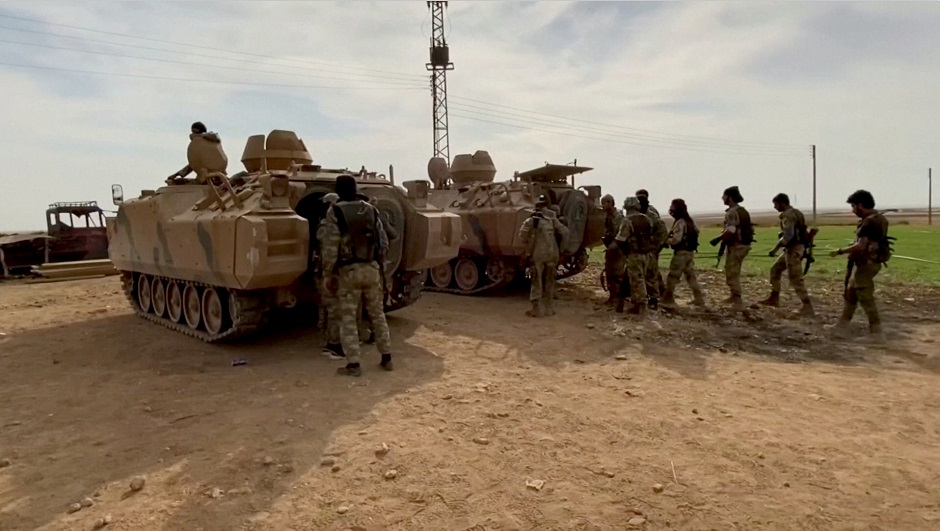 A Syrian militants declares the liberation of Mehrabli village from the Syrian Democratic Forces (SDF) near Tal Abyad. PHOTO: REUTERS