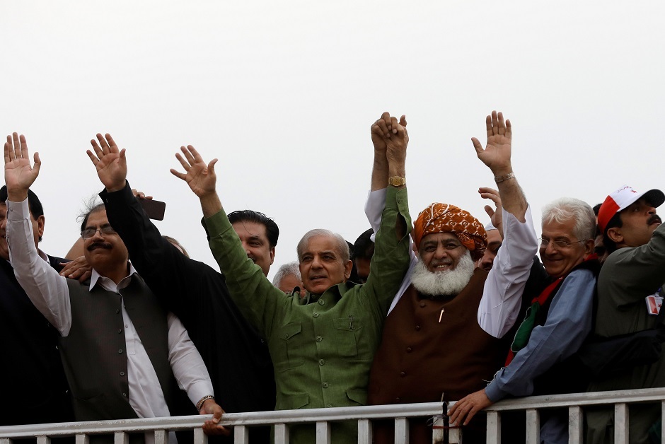 Fazal-ur Rehman, president of the Jamiat Ulema-e-Islam - Fazal (JUI-F) and Shehbaz Sharif, brother of former Prime Minister Nawaz Sharif, show solidarity during Azadi March. PHOTO: REUTERS