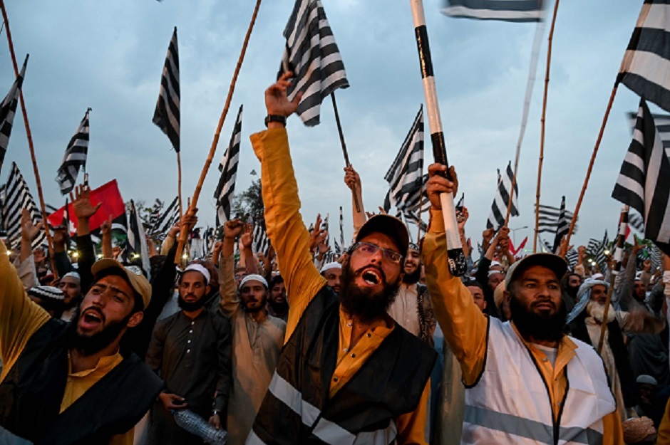 Supporters of Islamic political party Jamiat Ulema-e-Islam (JUI-F) shout slogans during an anti-government 