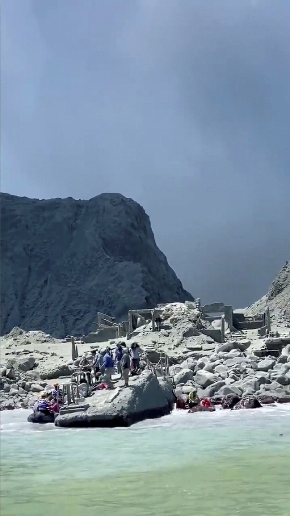 Tour guides evacuate tourists on a boat shortly after the volcano eruption on White Island, New Zealand. PHOTO: REUTERS 