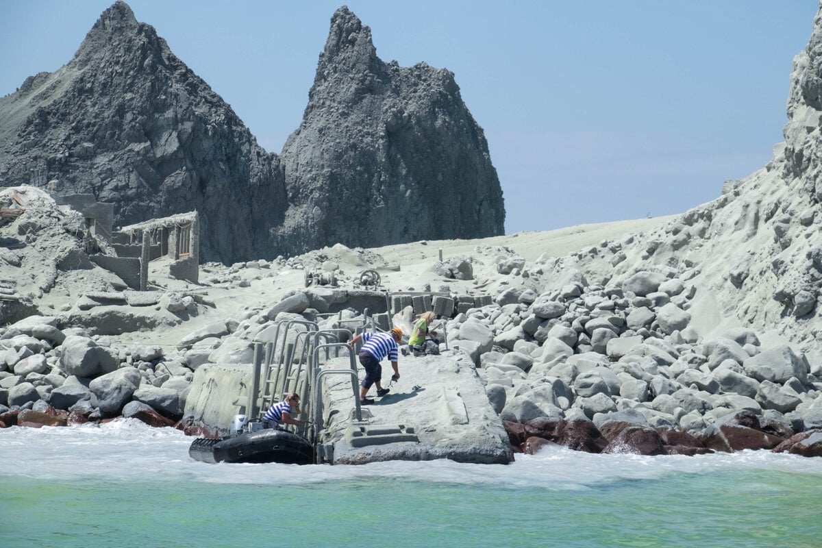  Tour guides evacuate tourists on a boat shortly after the volcano eruption on White Island, New Zealand. PHOTO: REUTERS 