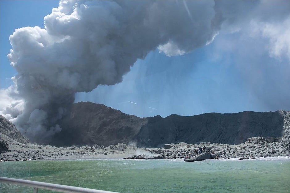 The picture shows the volcano on New Zealand's White Island spewing steam and ash minutes following an eruption. PHOTO: AFP 