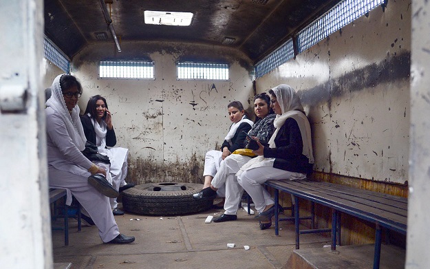 Women lawyers sitting in prison vans after police arrested them during a clash at PIC. PHOTO: ONLINE