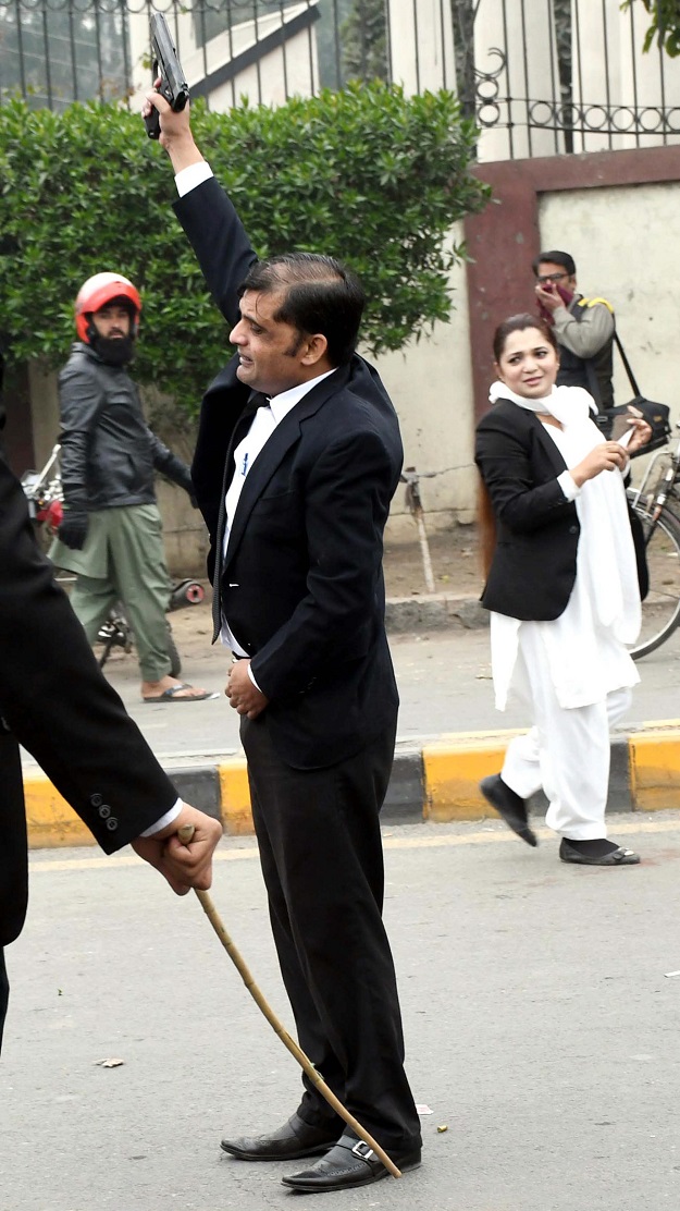 Lawyer opens a fire during clash at PIC in Lahore. PHOTO: PPI