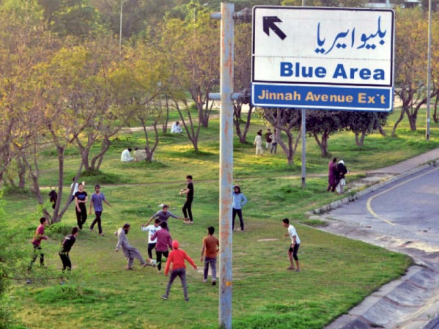 people play football on a greenbelt in islamabad despite a ban on the assembly of more than four individuals photo zafar raja express people play football on a greenbelt in islamabad despite a ban on the assembly of more than four individuals photo zafar raja express